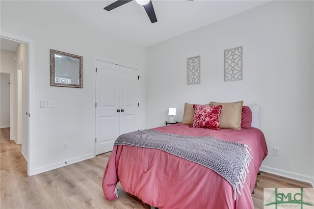 bedroom featuring ceiling fan, a closet, and light hardwood / wood-style flooring