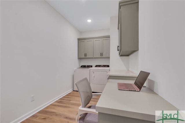 office with washer and clothes dryer and light hardwood / wood-style flooring