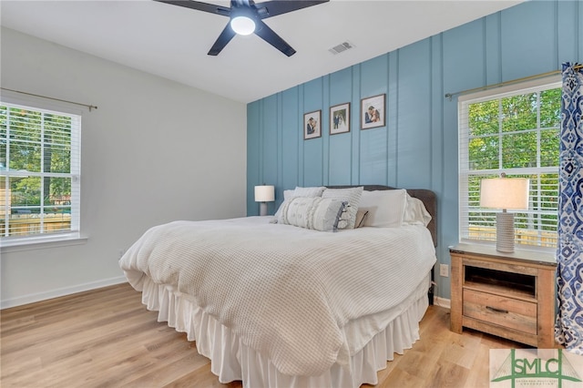 bedroom with ceiling fan and light hardwood / wood-style flooring