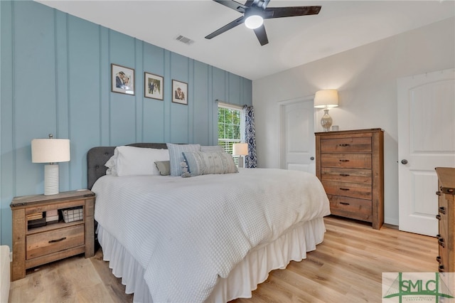 bedroom with ceiling fan and light hardwood / wood-style floors