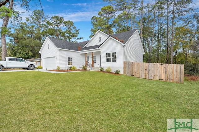 view of front of house with a front yard, a porch, and a garage