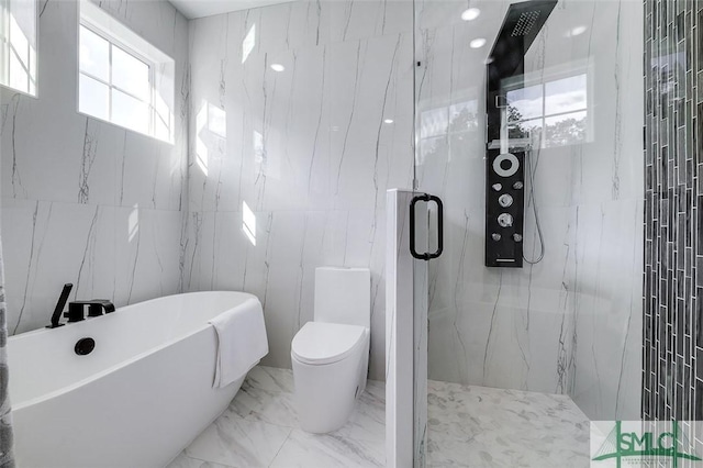 bathroom with shower with separate bathtub, tile walls, and toilet