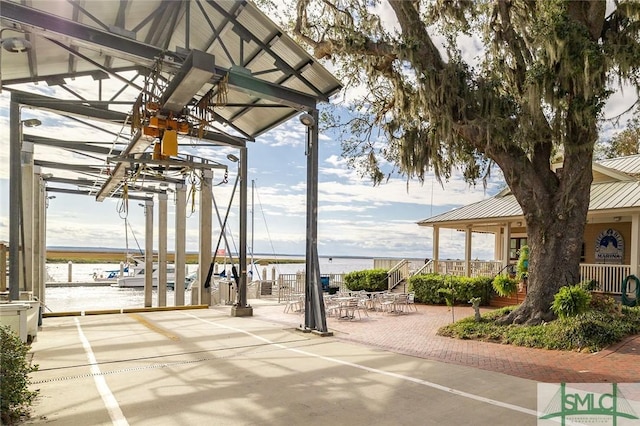 view of patio featuring a water view