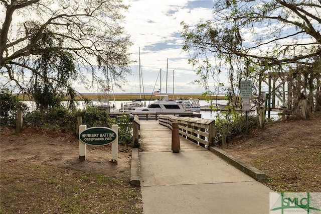 surrounding community featuring a water view