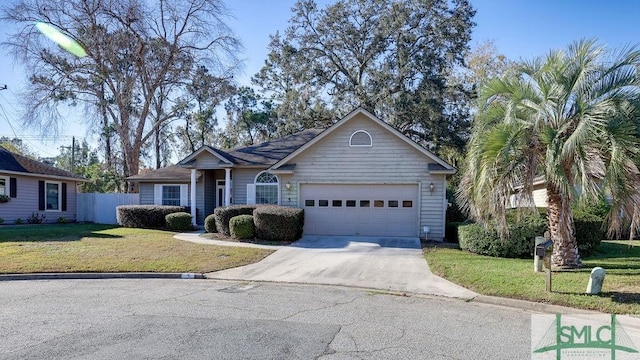 ranch-style house featuring a garage and a front lawn