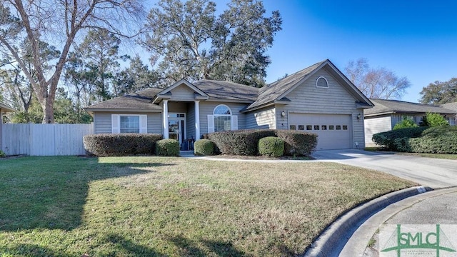 ranch-style house featuring a front yard and a garage