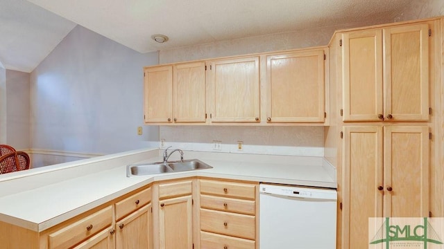 kitchen featuring white dishwasher, kitchen peninsula, sink, and light brown cabinetry