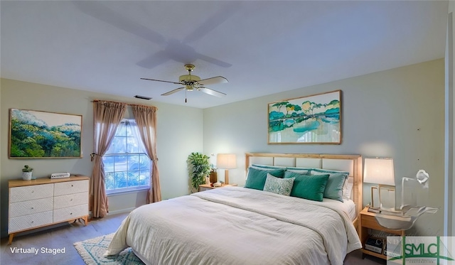 bedroom with wood-type flooring and ceiling fan