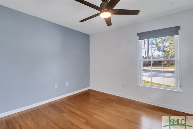 spare room featuring ceiling fan and light hardwood / wood-style floors