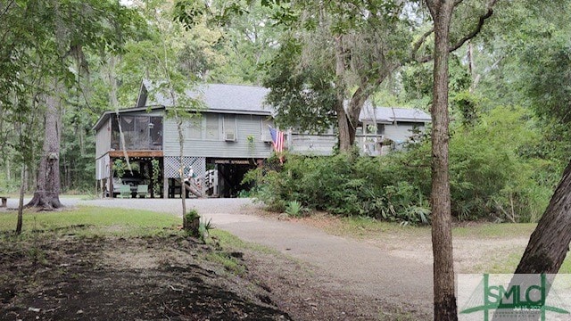 rear view of house featuring a carport