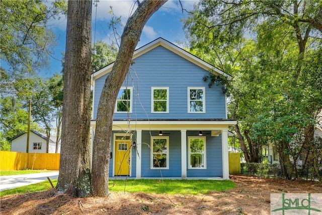 rear view of house featuring ceiling fan