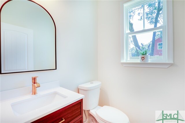 bathroom with vanity and toilet