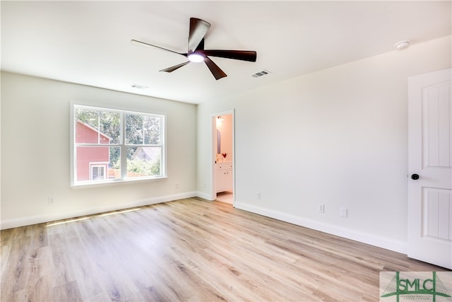 empty room with ceiling fan and light wood-type flooring