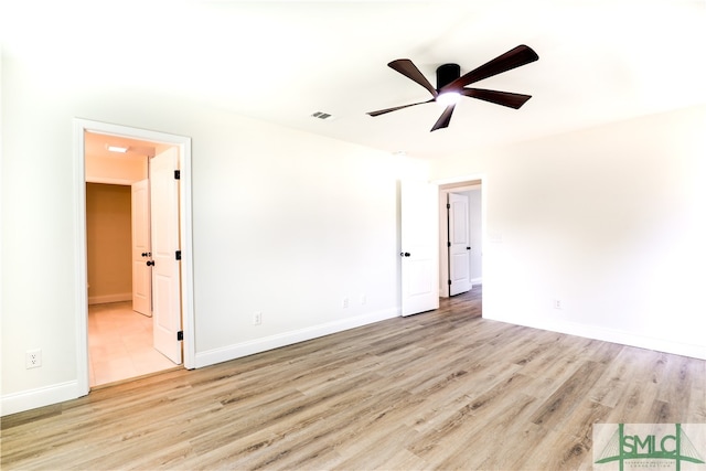 unfurnished room with ceiling fan and light hardwood / wood-style flooring