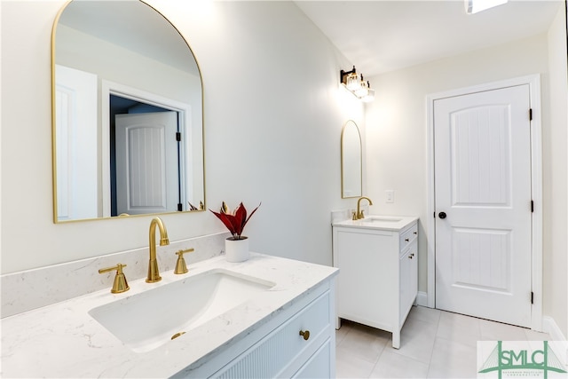 bathroom with tile patterned flooring and vanity