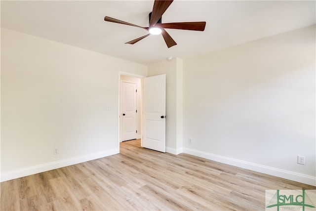 spare room featuring ceiling fan and light wood-type flooring