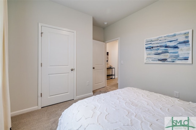 carpeted bedroom featuring a closet