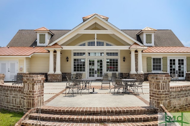 rear view of property featuring central AC, a patio area, and french doors