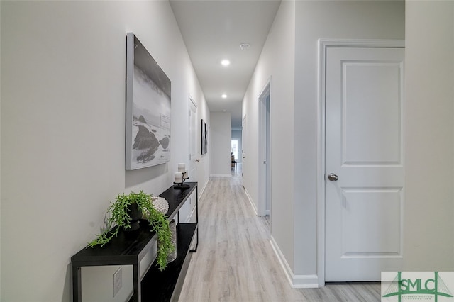 corridor with light wood-type flooring