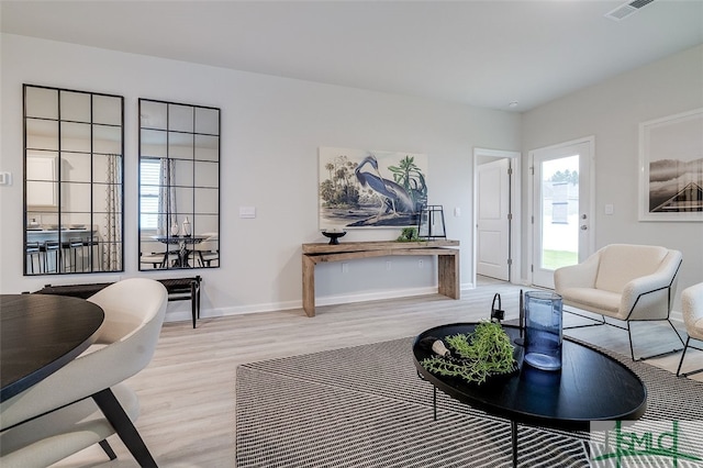 living room with light hardwood / wood-style floors