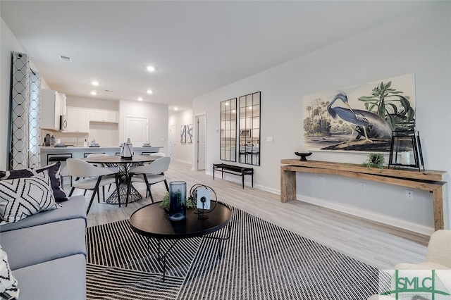 living room with light hardwood / wood-style flooring