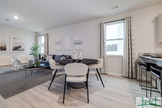 dining area with light wood-type flooring