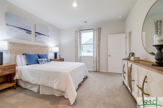 bedroom with light colored carpet