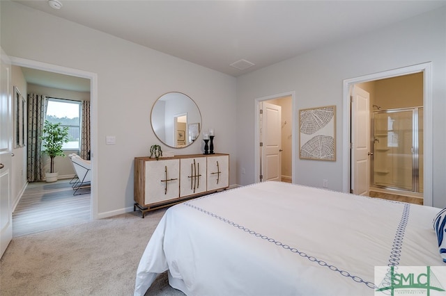 carpeted bedroom with ensuite bathroom