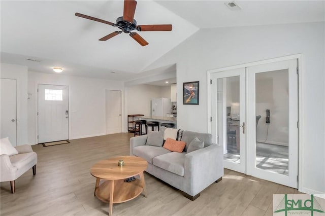 17 S Lake Dr, Savannah, GA 31410 - living area featuring french doors, vaulted ceiling, light wood-type flooring, and ceiling fan