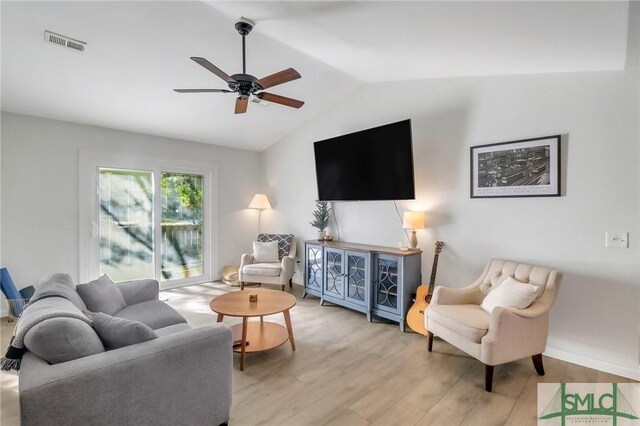 17 S Lake Dr, Savannah, GA 31410 - living room featuring vaulted ceiling, wood finished floors, a ceiling fan, and baseboards