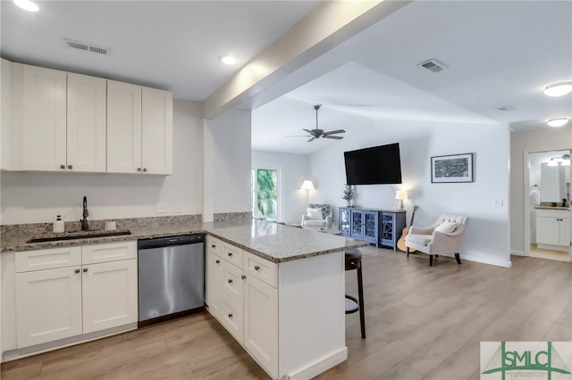 kitchen with dishwasher, white cabinetry, kitchen peninsula, and light hardwood / wood-style flooring