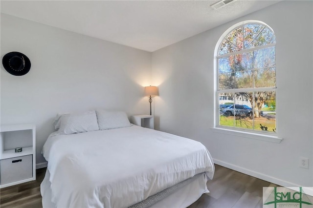 17 S Lake Dr, Savannah, GA 31410 - bedroom featuring dark wood-style flooring and baseboards