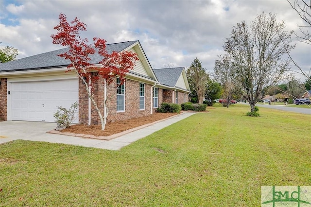 exterior space with a garage and a front yard