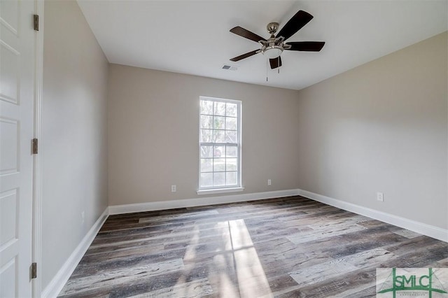 spare room featuring ceiling fan and hardwood / wood-style floors