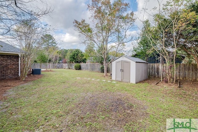 view of yard featuring central AC and a shed