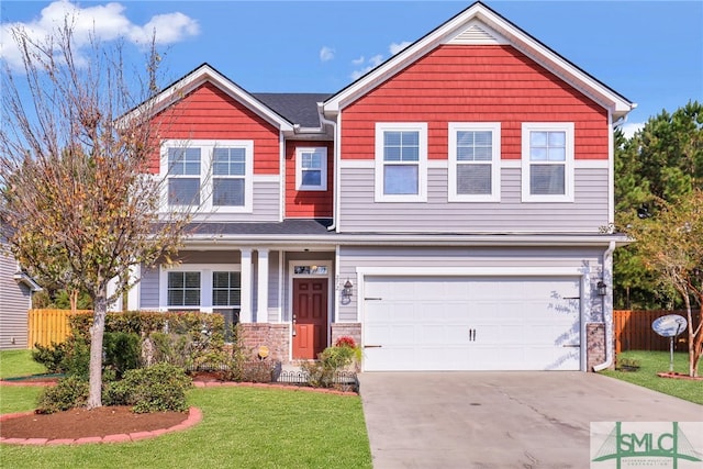 view of front of home featuring a garage and a front lawn