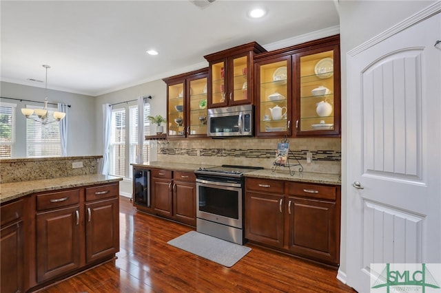 kitchen with hanging light fixtures, dark wood-type flooring, an inviting chandelier, wine cooler, and appliances with stainless steel finishes