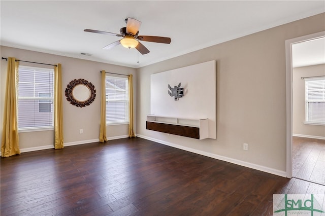 empty room featuring ceiling fan and dark wood-type flooring