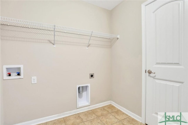 washroom with hookup for an electric dryer, light tile patterned floors, and washer hookup