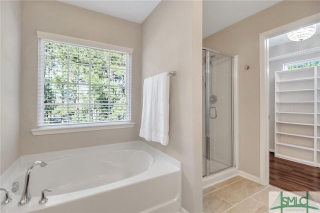 bathroom with separate shower and tub