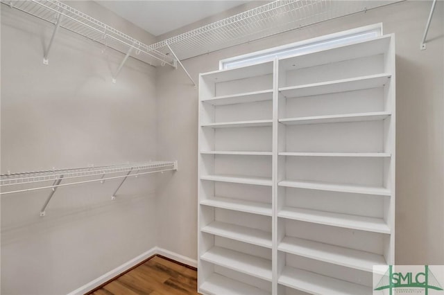 walk in closet featuring hardwood / wood-style floors