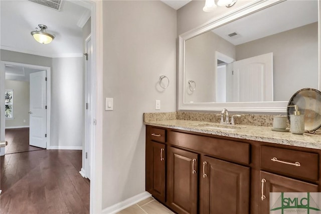 bathroom featuring hardwood / wood-style floors and vanity