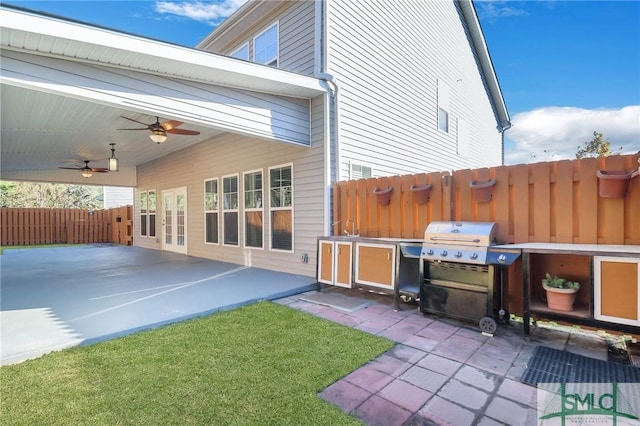 view of patio / terrace with a grill and ceiling fan