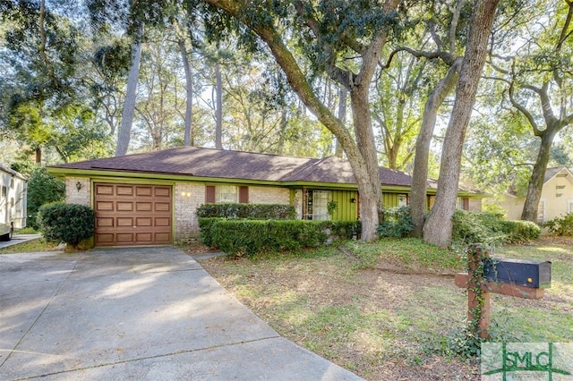 ranch-style house featuring a garage