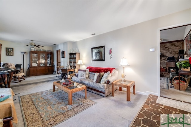 carpeted living room featuring ceiling fan