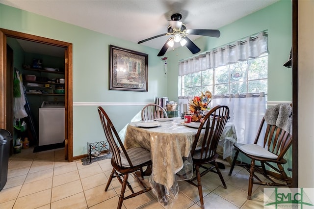 tiled dining space featuring washer / clothes dryer and ceiling fan