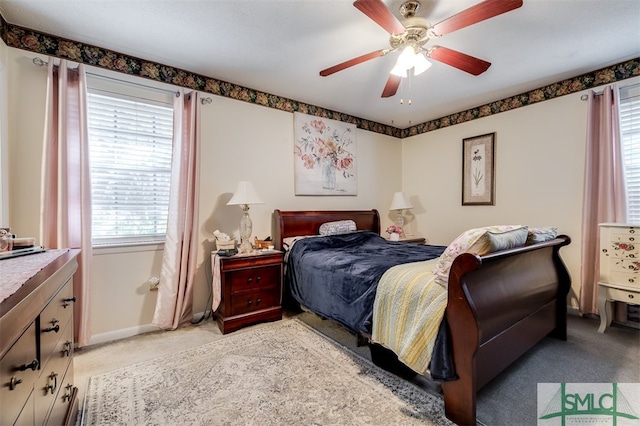 bedroom featuring light carpet and ceiling fan