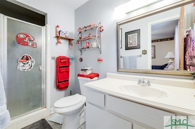 bathroom with walk in shower, vanity, and toilet