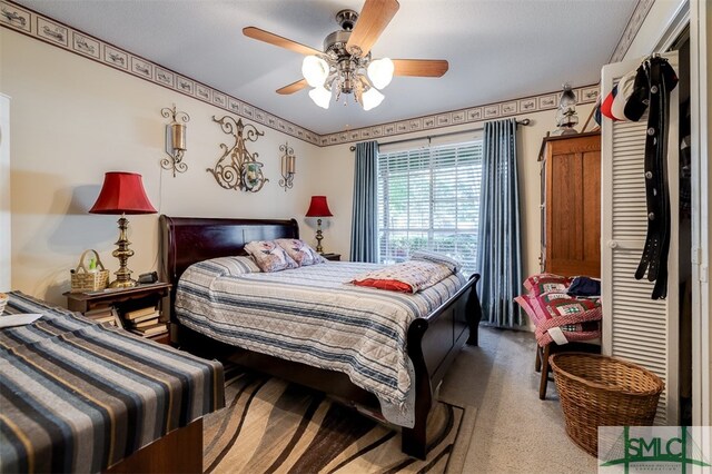 carpeted bedroom with ceiling fan