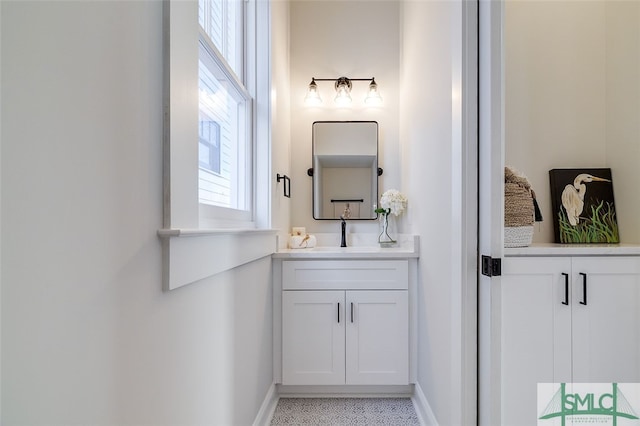 bathroom with vanity and plenty of natural light